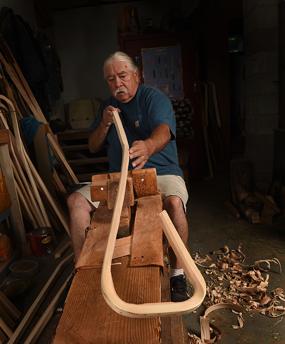 Cancer survivor Alf Jacques, 68, first began making traditional Iroquois wooden lacrosse sticks at the age of 12. He worked alongside his father, Louis Jacques, who understood the design concept but had never actually crafted sticks himself. Through trial and error, the two learned how to make sticks together. (PHOTO BY JOHN BERRY)
