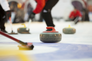In the sport of curling, players use brooms to sweep a path along the ice for the granite curling sto