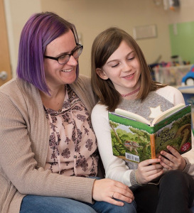 Nora with her mother, April McCaslin, who keeps alert for when Nora is unusually tired or feeling painful flares. (PHOTO BY SUSAN KAHN)
