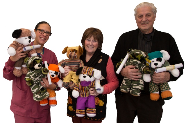 Child life specialist Gina Lozito-Yorton, left, with Glenda and Fred Stowell, who create and donate stuffed animals to children at the Upstate Golisano Children‘s Hospital. (PHOTO BY KATHLEEN PAICE FROIO)