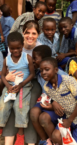 Cyndy Carr, an oncology nurse at Upstate, with a group of Ghanaian students who received toothbrushes and toothpaste - and instruction on good brushing habits - as part of an oral health program. (PHOTO BY MEGHAN LEWIS)