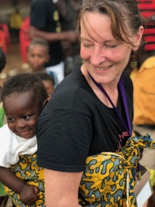 Lauri Rupracht, an Upstate pediatric nurse and founder of the Americans Serving Abroad Program, or ASAP, holds a baby during a November 2017 mission trip in Ghana. (PHOTO BY MEGHAN LEWIS)