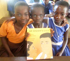 Every school received autographed copies of My Daddy‘s Eyes by Syracuse author Fatimah Salaam. (PHOTO BY SUSAN KEETER)