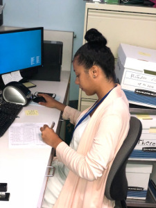 Vivian Gousby, a Le Moyne College student, at work at Upstate's Margaret L. Williams Developmental Evaluation Center. (Photo by Amani Mike)