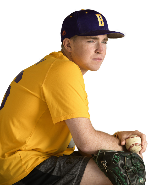 Baseball pitcher and cancer survivor Jack Sheridan, now a sophomore at Le Moyne College, is shown in the team colors of his high school, Christian Brothers Academy. He is a board member of On My Team16, a charity to help children hospitalized for cancer. (photos by Robert Mescavage)
