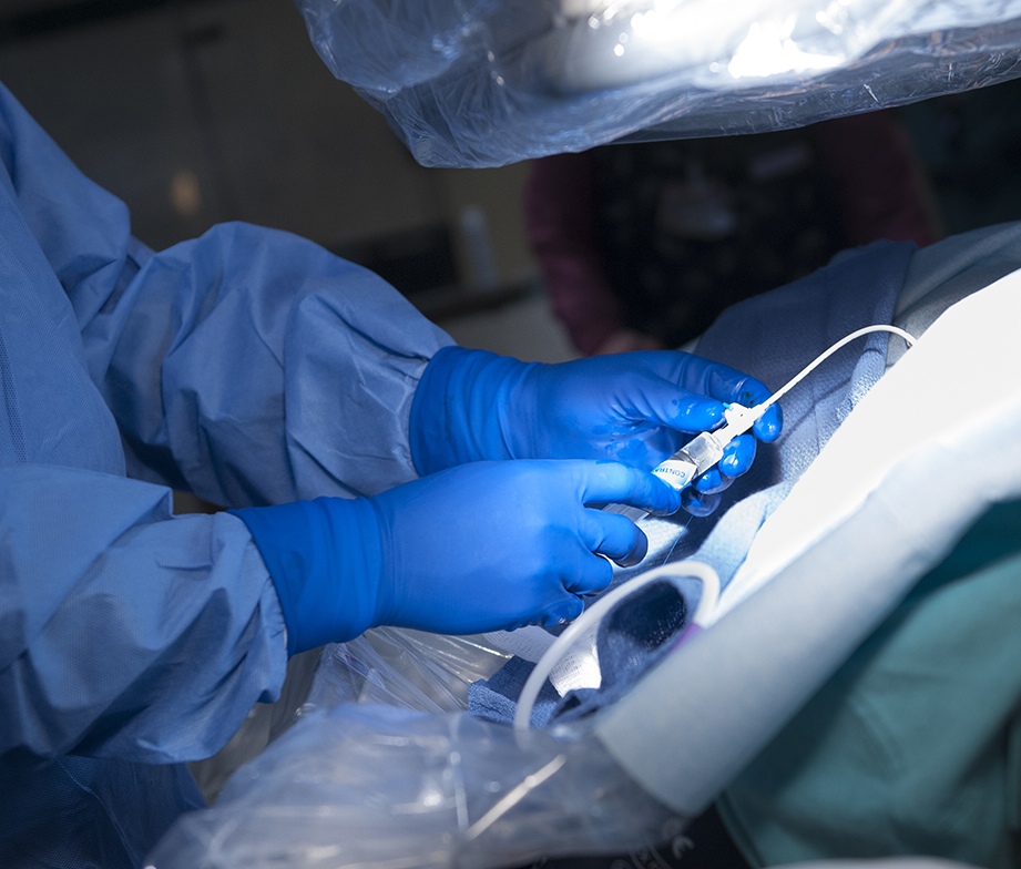 Close-up of Mitchell Karmel, MD, performing a nephrostomy tube check, a procedure to evaluate whether a kidney remains obstructed and to evaluate the position of the tube. (photo by Susan Kahn)
