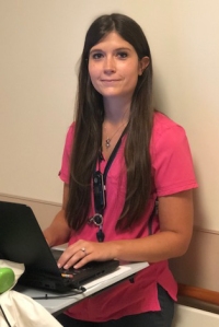 Occupational therapist Michelle Malchak is shown completing a patient's evaluation. (photo by Amani Mike)