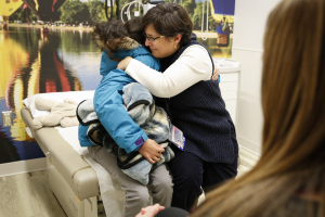 Upstate pediatric cancer chief Melanie Comito, MD, gives Lola a goodbye hug.
