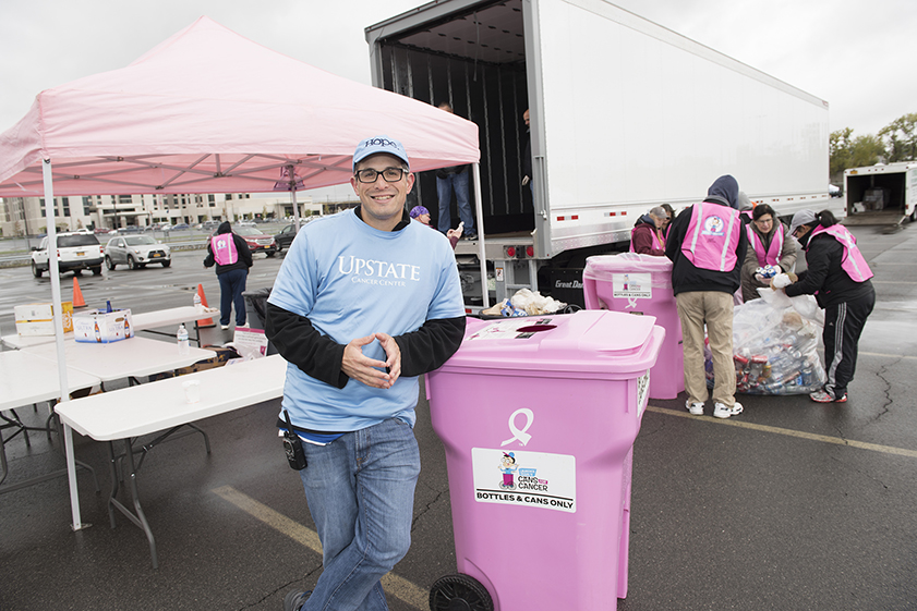 Laurence Segal and volunteers at a can and bottle collection drive near Destiny USA mall. (photo by Susan Kahn)