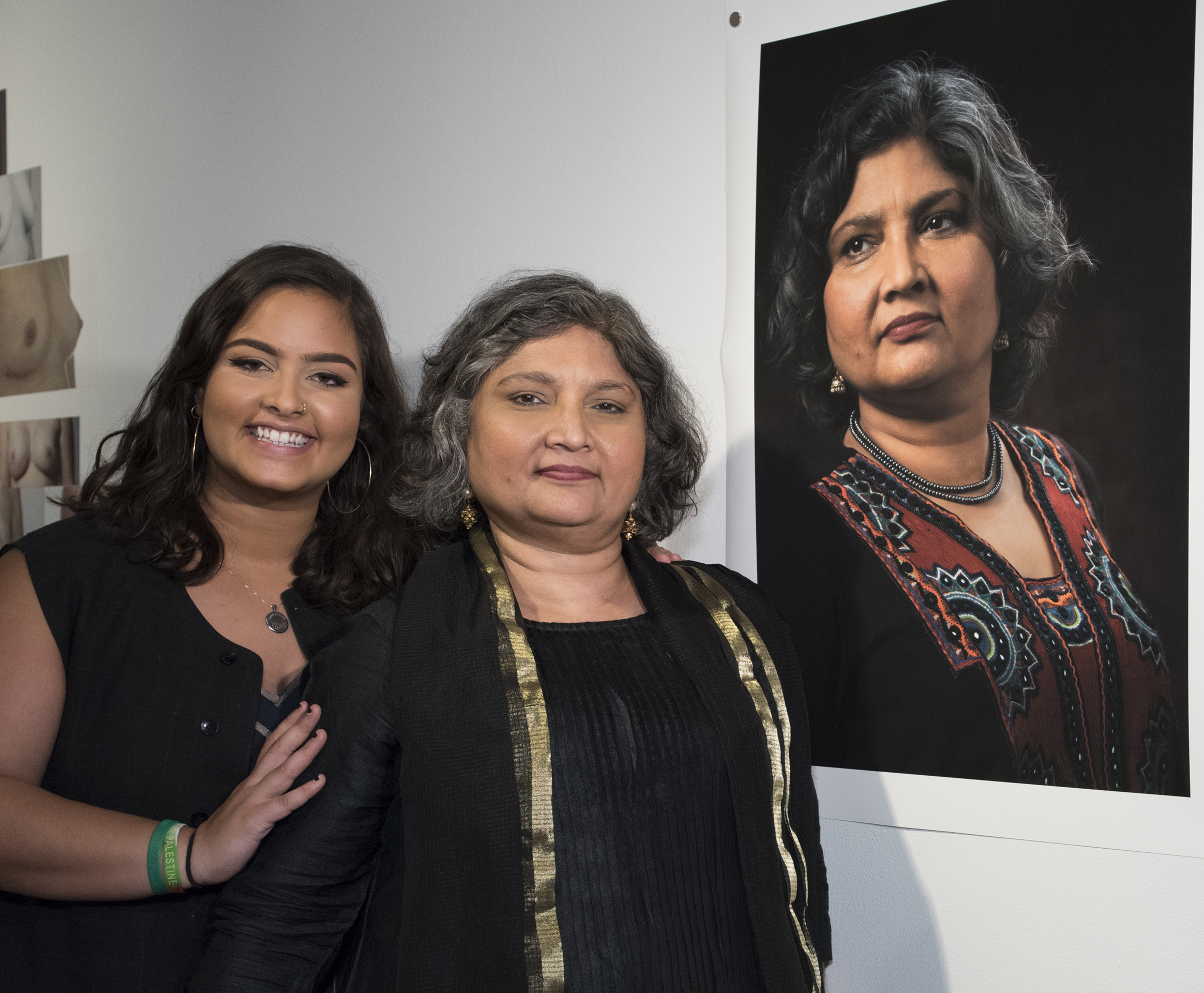 Tula Goenka, center, with her daughter, Ranya Shannon, who was 9 when Goenka was diagnosed with breast cancer, standing next to Cindy Bell‘s portrait of Goenka at the Look Now exhibition. (This and the following photos taken at the opening of the exhibit are by Susan Kahn, the Look Now exhibition portraits shown are by Cindy Bell)