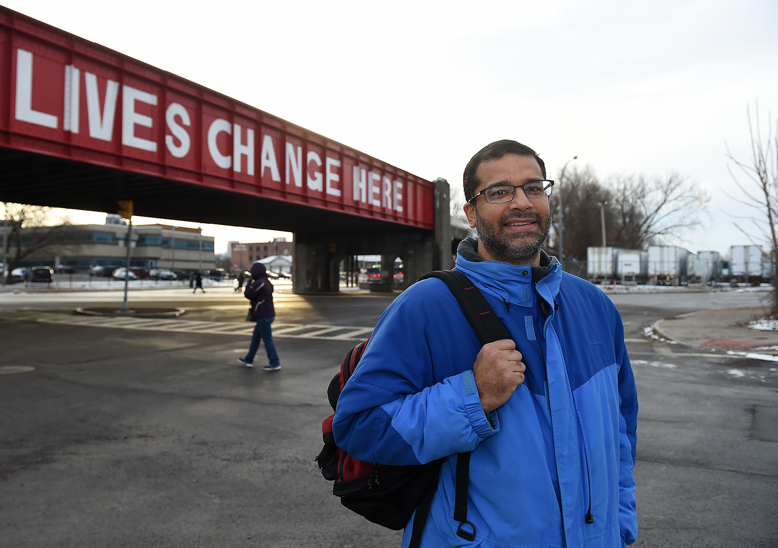 Sunny Aslam, MD, shown at the Gifford Street railroad overpass near the Rescue Mission in Syracuse, offers mental health care to the homeless. (photo by John Berry)
