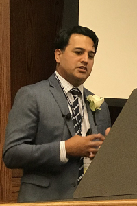 Patrick Basile, MD, '03, giving a lecture at Upstate in 2018.