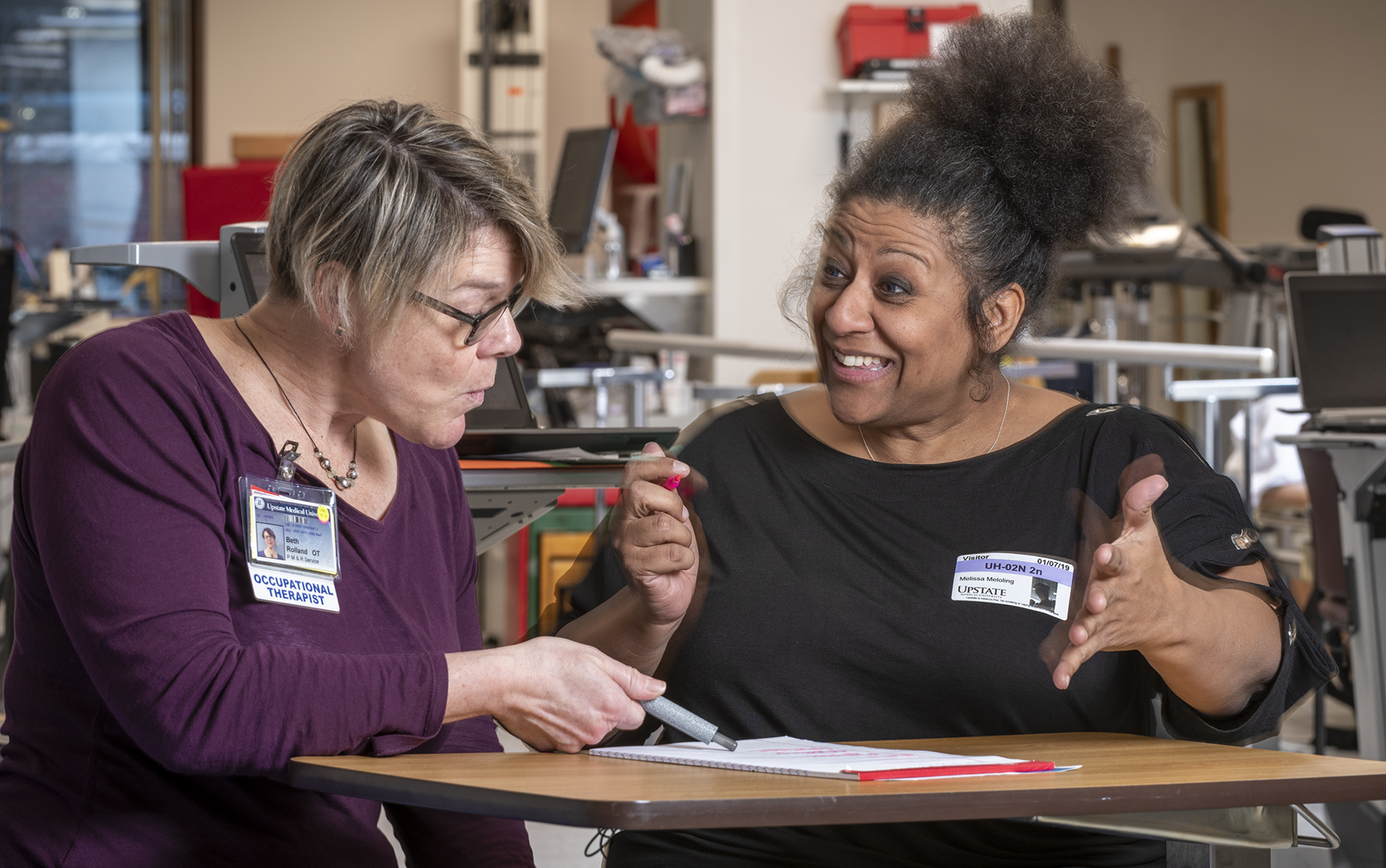 Occupational therapist Beth Rolland, left, with stroke rehabilitation patient Melissa Meloling, during a therapy session. (photo by Robert Mescavage)