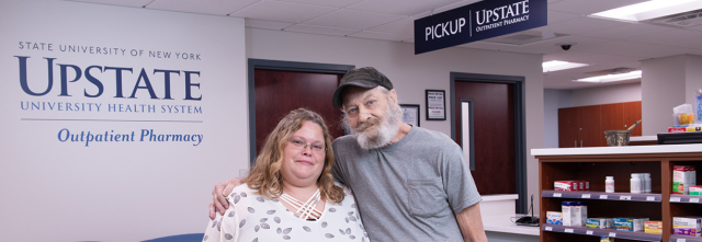 Heidi King with Reginald Sanford at the Upstate Outpatient Pharmacy. (photos by Robert Mescavage)