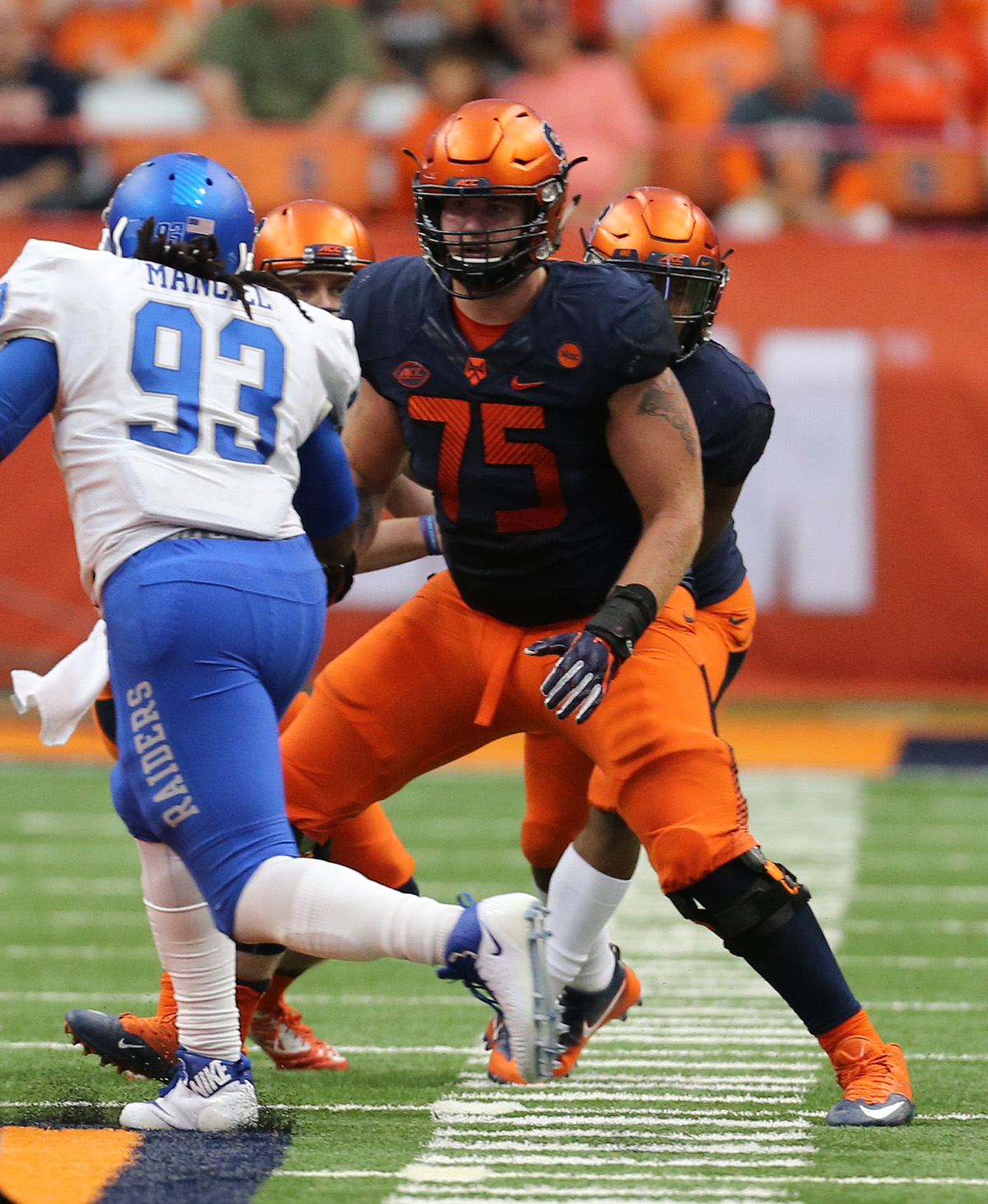 Heckel, (No. 75), blocks defensive tackle Malik Manciel (No. 93) during an SU vs. Middle Tennessee State University game. (photo courtesy of Syracuse University Athletics)