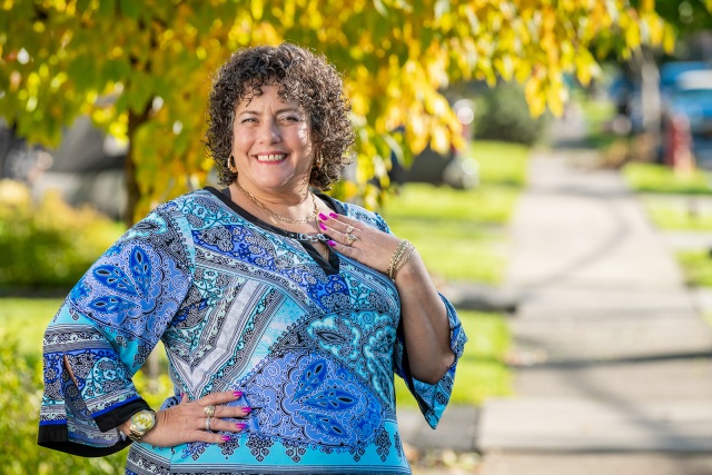 A two-year survivor of stage 3 ovarian cancer, Aimee Derbyshire is thankful for her family and friends, her Eastwood neighborhood and the care she received from Mary Cunningham, MD, and her staff. (photo by Robert Mescavage)