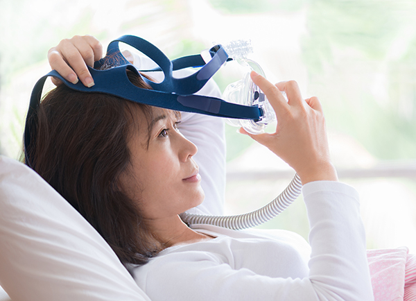 Sleep apnea is often treated by having the patient use a continuous positive airway pressure (CPAP) device when sleeping. The device includes a mask to wear over the face, as shown above.