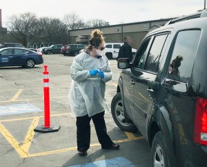 Upstate nurse Julia Burns greeted a patient at the coronavirus testing site at the Upstate Specialty Services at Harrison Center.