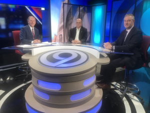 Upstate University Hospital CEO Robert Corona, DO (center), and Stephen Thomas, MD, chief of infectious diseases (right), share their COVID-19 expertise with Dan Cummings, NewsChannel 9 anchor. (photo courtesy of NewsChannel 9)