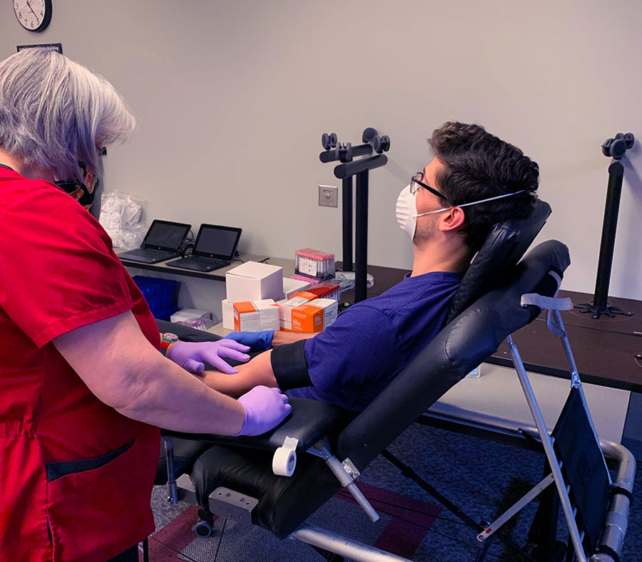 Luke Slate, a third-year medical student from Buffalo, gave blood at a drive that saw many students volunteer. (photos by Charles McChesney)