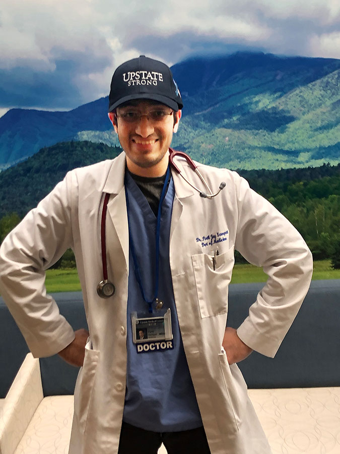 Internal medicine resident Parth Sampat, MD, models one of the "Upstate Strong" caps that was distributed to hospital staff.