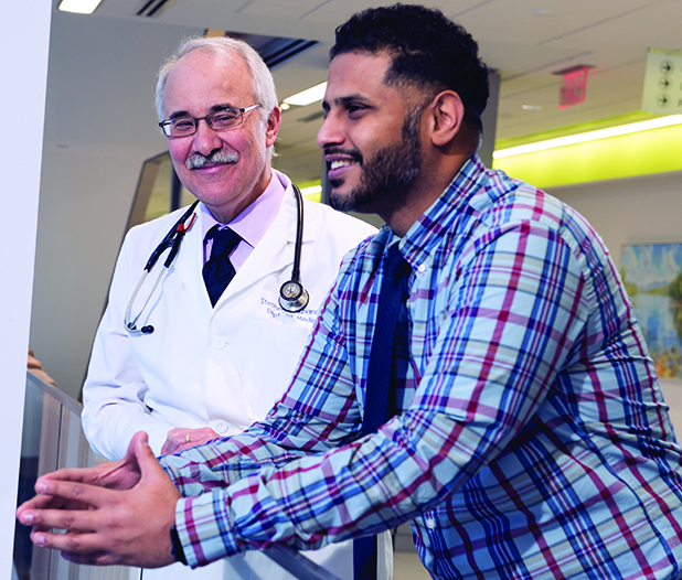 Nurse practitioner — and cancer survivor — Ibrahim Thabet, right, with his Upstate oncologist and colleague, Stephen Graziano, MD. (photo by Susan Kahn)