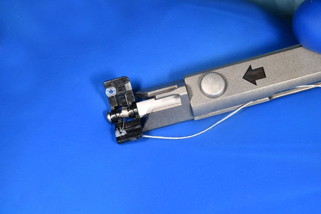 The device that is used to connect two veins is shown in close-up. (photos by William Mueller)