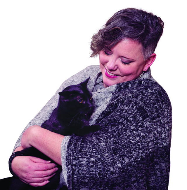 Christina Wallace with her cat, Gracie, who helped her find a lump. (photo by Susan Kahn)