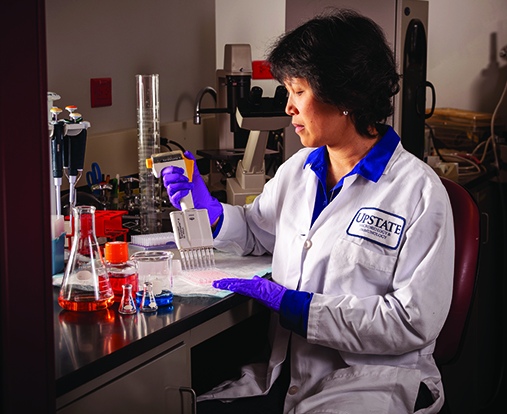 Staying busy, including working full time, helps Coombs feel normal and manage her fears about cancer returning, she says. (photo by Robert Mescavage)