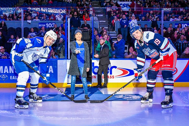 To raise awareness of lung cancer, Coombs was asked to drop the puck at a Syracuse Crunch hockey game last fall. (photo courtesy of the Syracuse Crunch)