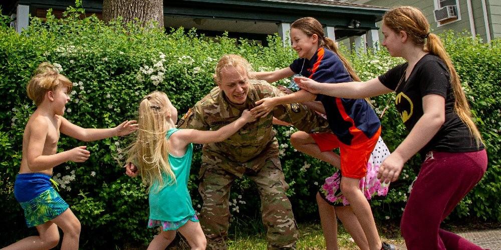 Army Reserve Col. and nurse practitioner Patricia Goodyear and her five children, ages 6 to 12. (photo by N. Scott Trimble/Syracuse Media Group)