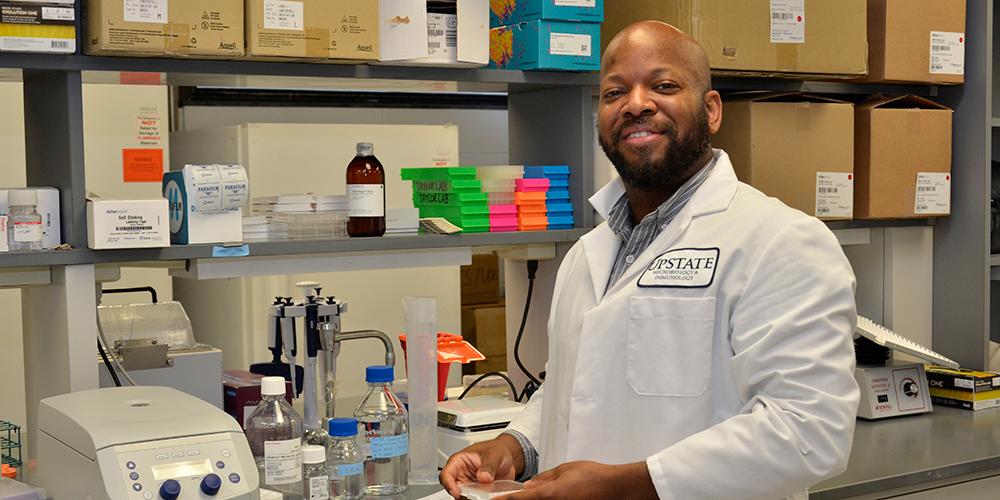 Research by Upstate’s Harry E. Taylor, PhD, provides insight into the way that HIV fuels infection. (photo by Debbie Rexine)