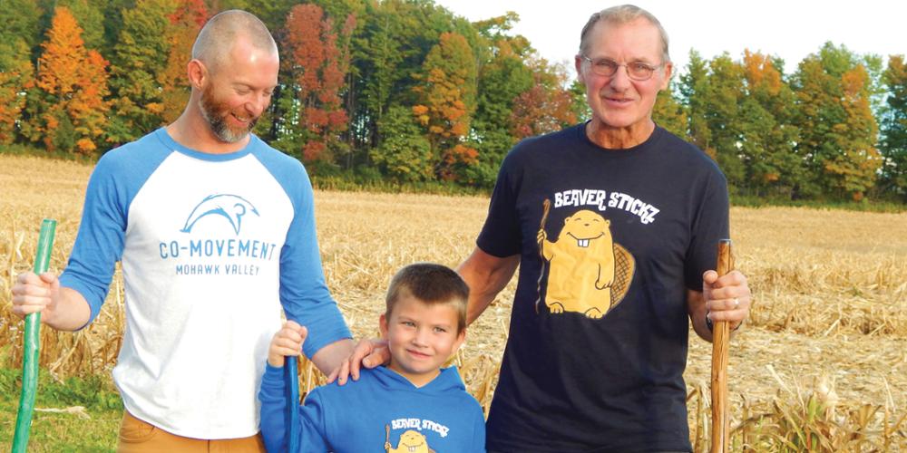 Asher Anken, center, with his stepfather, Josh Lewis, left, and grandfather Ron Whitford, right. Asher was hiking when he got inspired to make walking sticks. (photo by Patty Louise/Waterville Times)