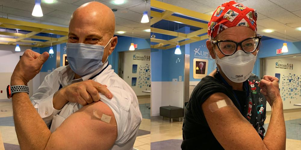 Upstate University Hospital CEO Robert Corona, DO, left, and nurse Jacqueline Roe moments after receiving the COVID-19 vaccine.
