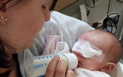 Natalie’s mother feeds her after the operation. (provided photo)