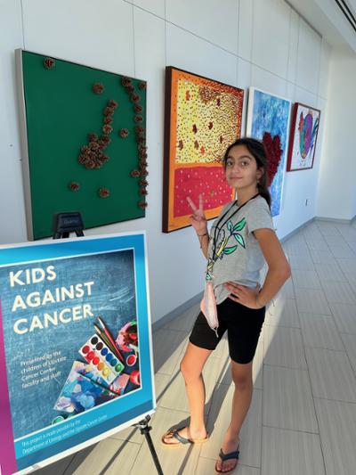 Emma, shown with her works, plans to be an actress and appears on a local public TV series.